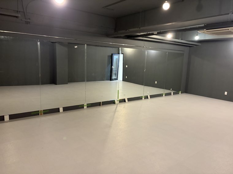 Dance academy with full-wall mirrors and sprung floors